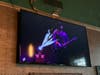 The TV is set to Steampunk bands inside Club 201. 