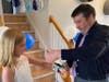 Dad Matt puts on a corsage on Zoey.