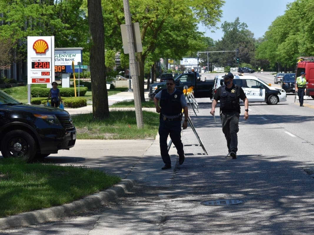 Police investigate the scene at the 700 block of Waukegan Road in Glenview. 