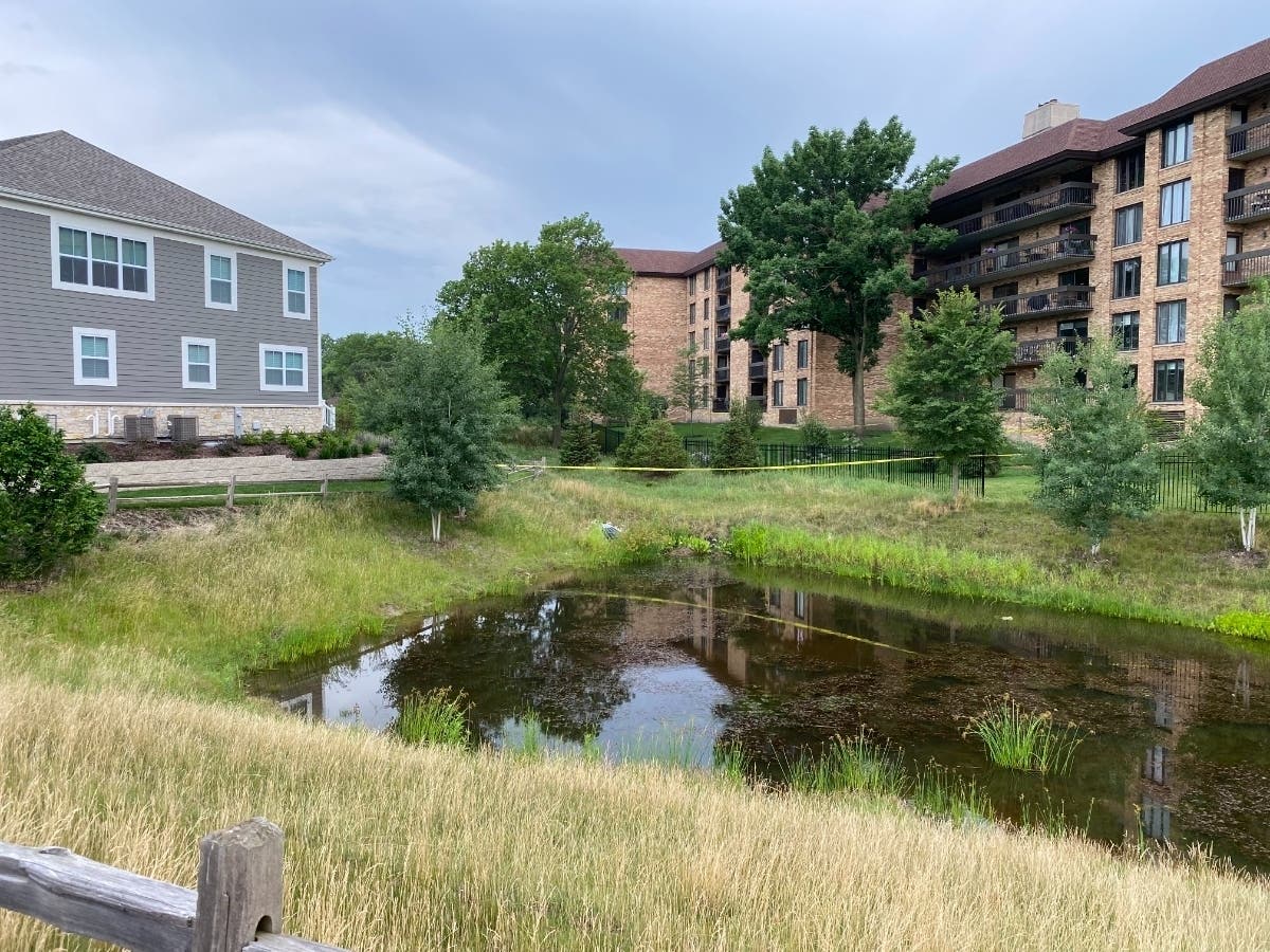 The retention pond is located near an apartment building in a Mission Hills condo complex.