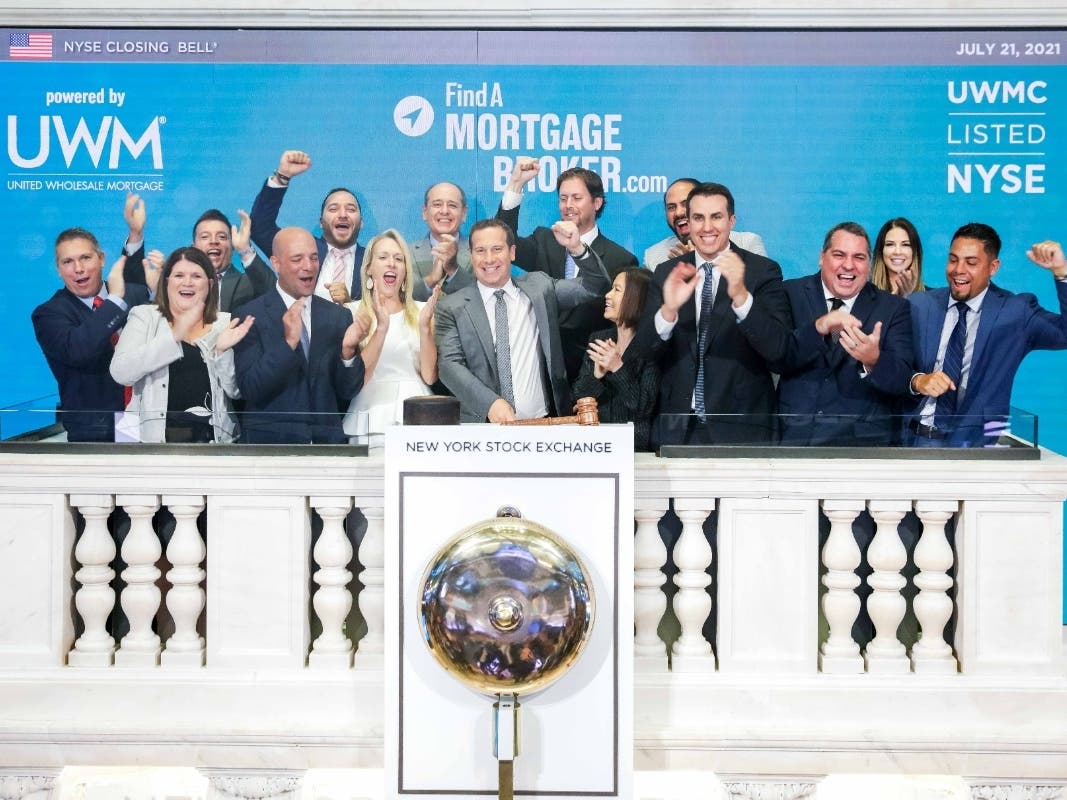 Local mortgage broker Michael Blackhall and others are honored July 21 during the closing bell of the New York Stock Exchange.