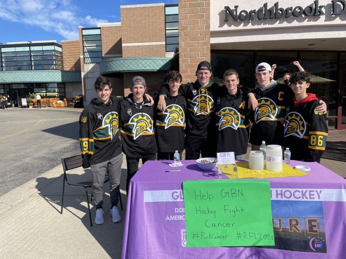 Players from the Glenbrook North Hockey Club raise money outside of Georgie V's at the Northbrook Shopping Plaza.