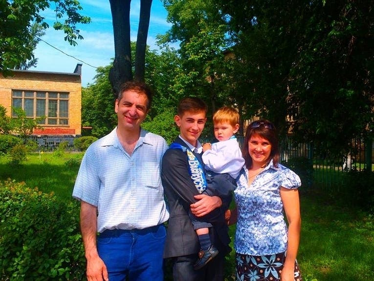 Volodymyr Boikov (left) and his oldest son, Vlad, 20, remain in Kyiv, Ukraine, while his younger son, Artem, 8, and his wife, Natalia, have fled the country to Poland. 