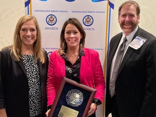 Westmoor teacher Beth Coughlin, Principal Mary Sturgill and Superintendent Dr. Jason Pearson accept the National Blue Ribbon Schools award for Westmoor School during a U.S. Department of Education ceremony in Washington, D.C. on Friday, Nov. 4.