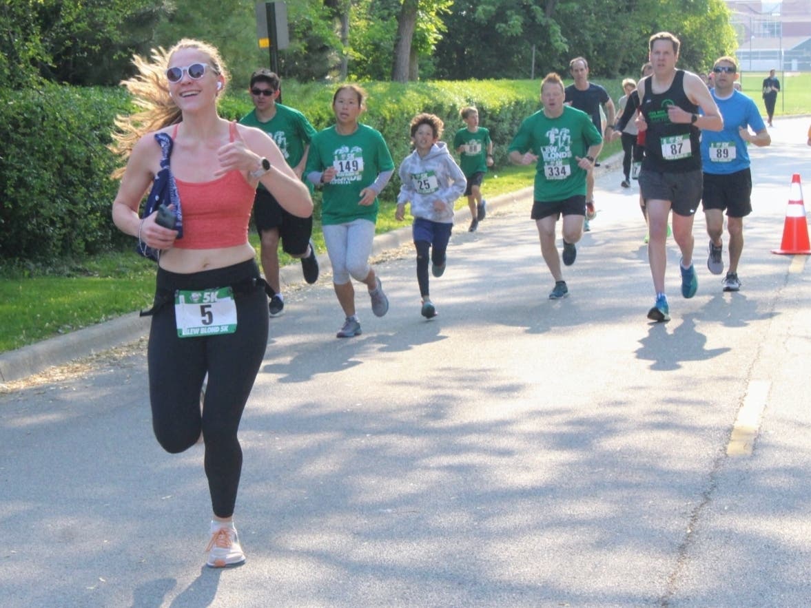 Brinn Anderson, of Northbrook, breaks out ahead of the pack during the 5K. She finished second place in the female division in 21 minutes, 11 seconds. 
