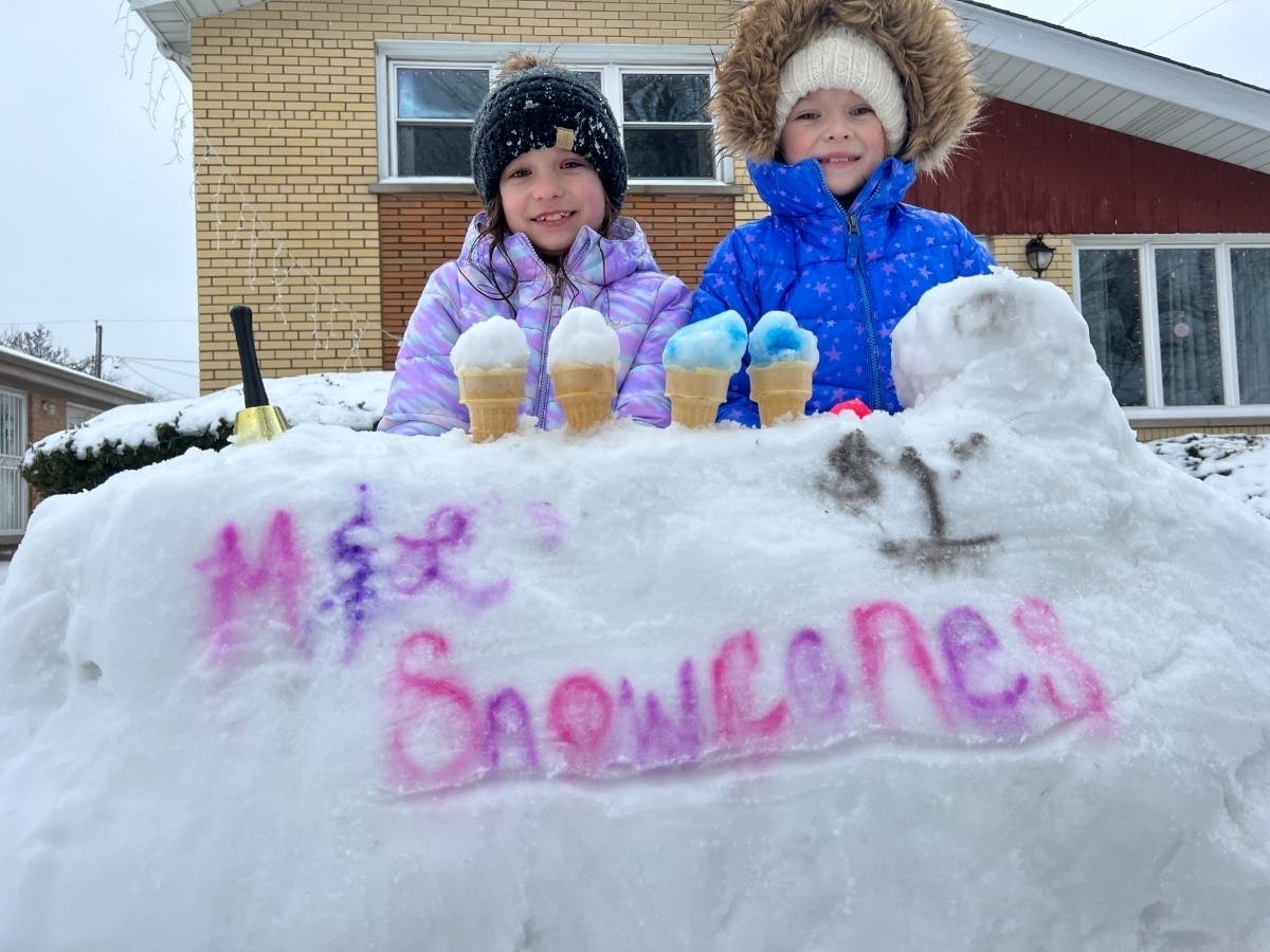 Kim Waters, of Oak Lawn, submitted this photo she took of her daughters, Maddy and Lilly, who made a snow cone stand equipped with a cash register and “order up” bell. 
