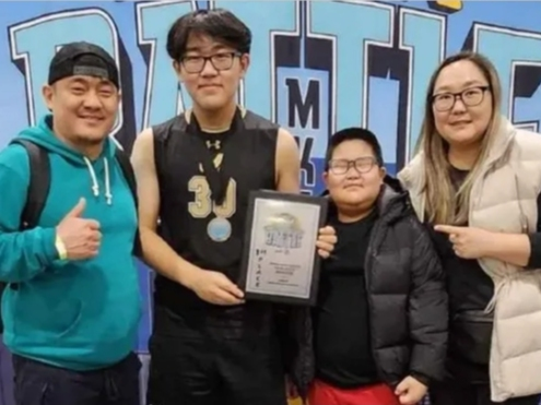 Anand Khatanbaatar (second from left) is seen here with his brother, Adam, 7, and parents.