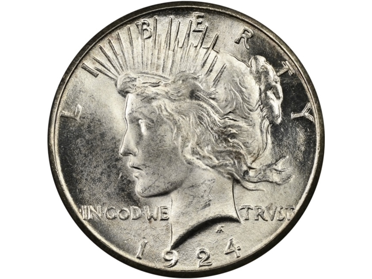 A rare peace dollar, which circulated between 1921 and 1935, is shown. 