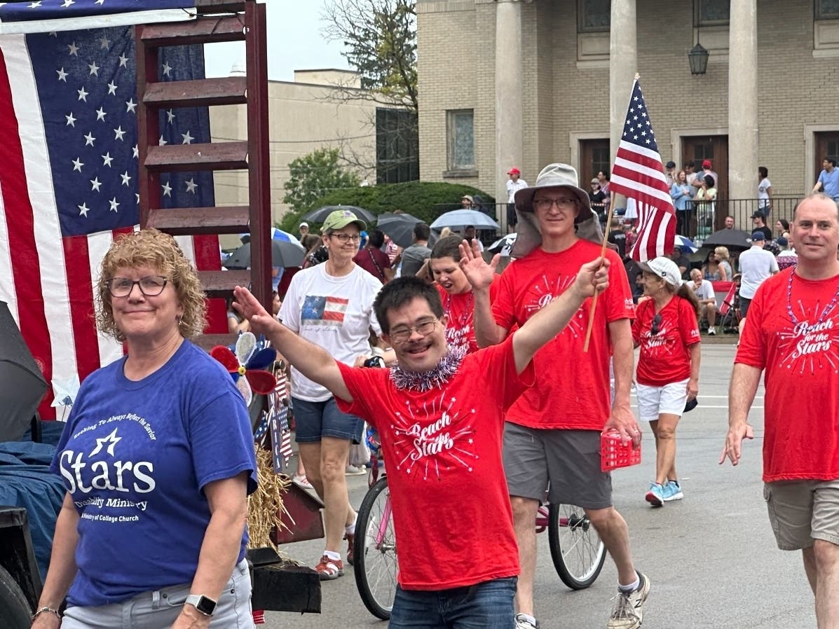 Shauna Hauert captured this special moment of her brother, BJ Kettinger, marching in the Wheaton 4th of July parade with the STARS from College Church of Wheaton.