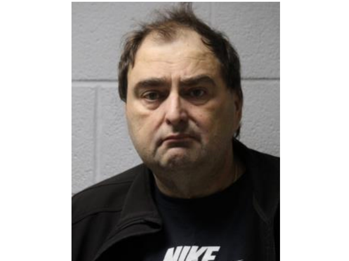 Charles S. Poulos was arrested Tuesday evening and was being held at the Glenview Police Department prior to a pretrial conditions hearing.