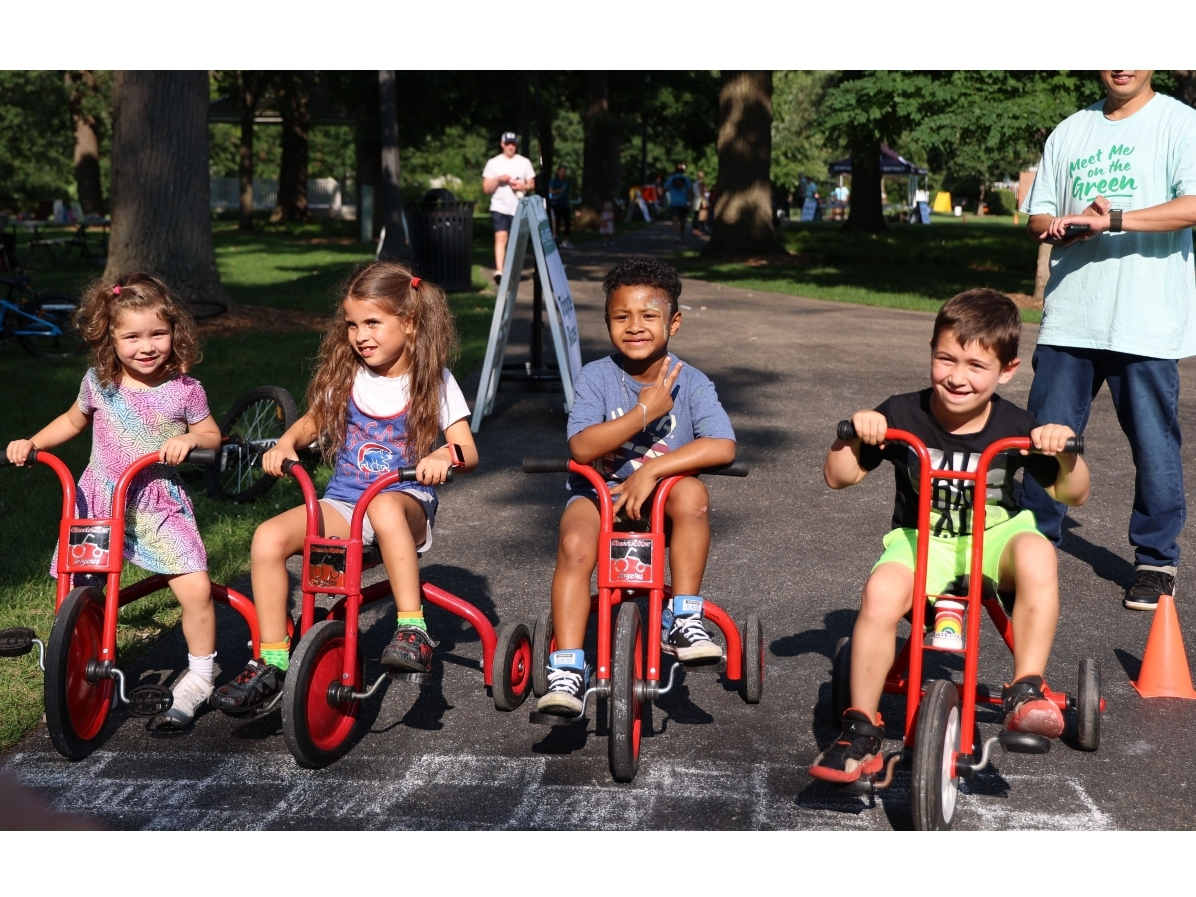 The day of activities concludes with the community ride, which attracted 100 children and adults in 2024. 