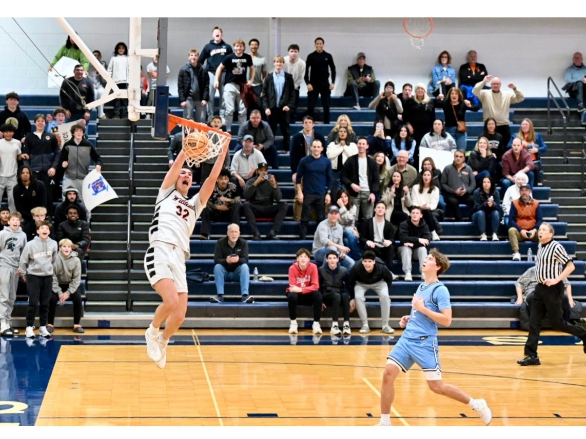Kevin Griffin got this amazing shot of Bryce Wegrzyn scoring his 1000th career point for the Libertyville High School basketball team on the first game of his senior year season.