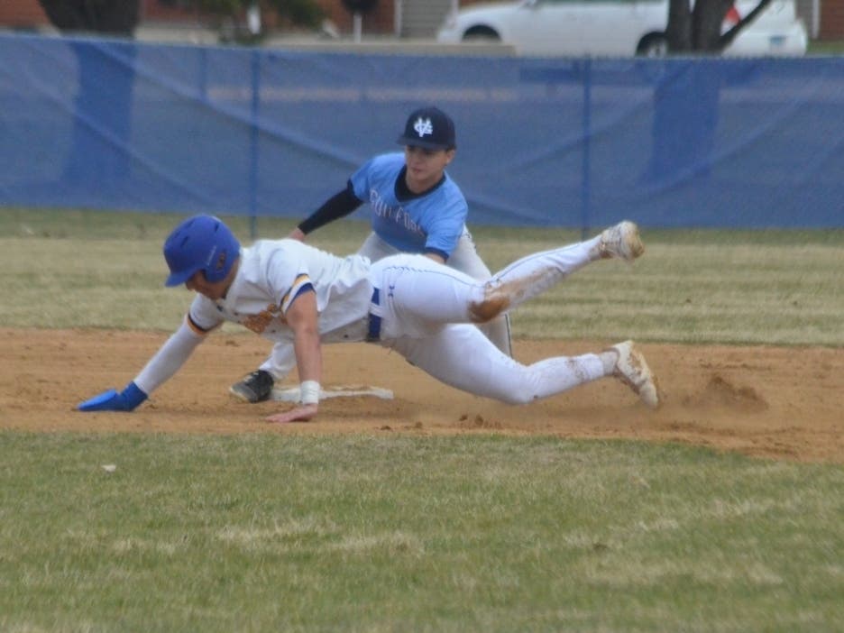 Frequent contributor Al Benson submitted this photo he took of Aurora Central Catholic's Jack Hughes (19) going airborne while Guilford shortstop Sam Goodrum makes the tag at second base in the Chargers' 7-4 loss Saturday, March 21, in Aurora.