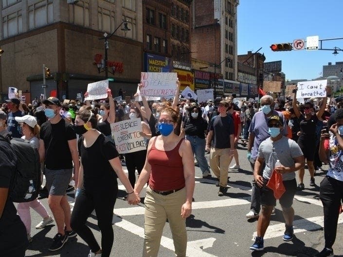 People rally in Newark, NJ to protest the death of George Floyd on May 30, 2020.