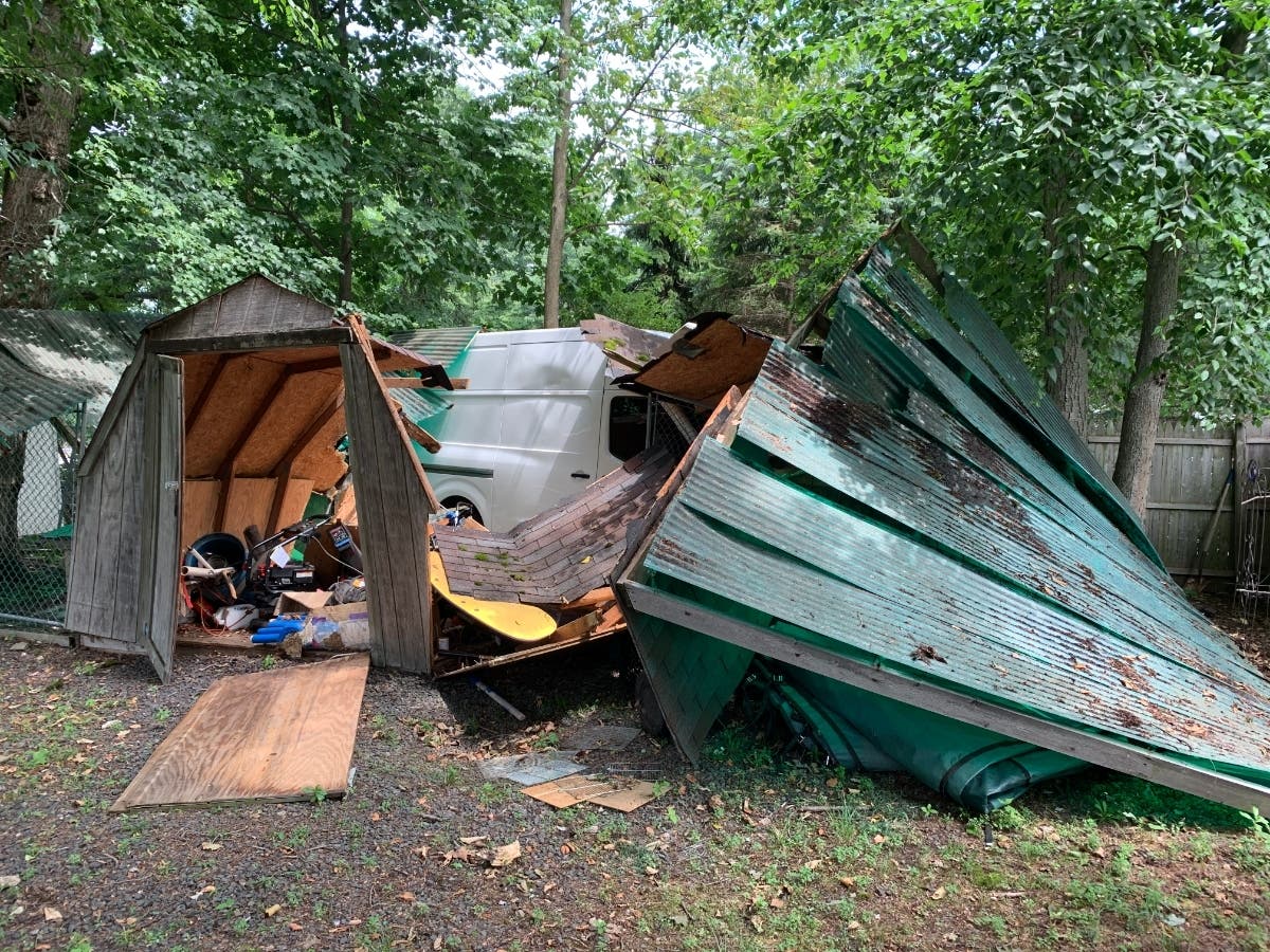 Police say the driver of a cargo van ran off Route 208 and into a Wyckoff backyard, destroying a shed in the process.
