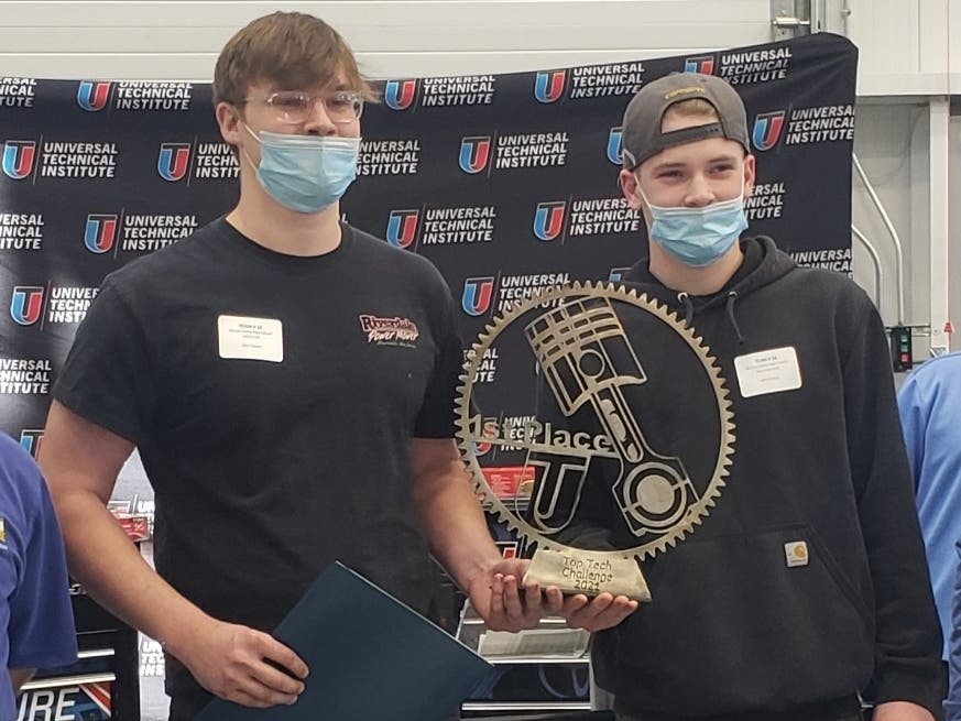 Ryan McVeigh and James Lee received a winning team trophy in addition to scholarship money.