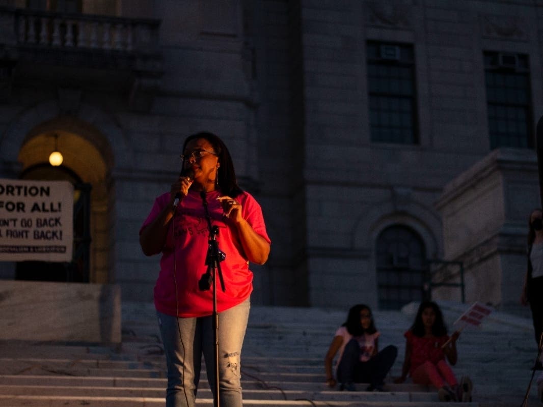 Jennifer Rourke speaks at an abortion rights rally in Providence on Friday, June 24. Video captured Jeann Lugo punching Rourke the same night. He's since been put on leave, and charged with assault and disorderly conduct.
