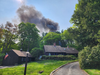 Photos of smoke from the fire taken by a neighbor on Monday.