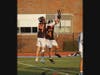 Sophomore Ollie Cronin (24) and junior Preston Penn (4) celebrate a Ridgefield goal against Ludlowe