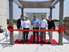Rahway Mayor Raymond Giacobbe (center) joined principals from joint-venture developers Fields Grade and Slokker USA for a special ribbon cutting ceremony to welcome the second luxury building at The Mint.