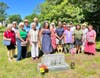 Members of Pomham Rocks Lighthouse honor the service of sixth lightkeeper, William James Howard, at his gravesite in Pocasset Cemetery in Bourne, Mass.
