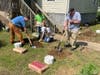 CAM volunteers installing the footings for a new wheelchair ramp for one of the residents of Harlan, KY