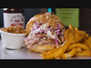 Big Joe's Mouth-watering pulled pork sandwich, beans, and fries