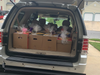 The Thanksgiving meal baskets, boxed up, loaded up, and ready to be delivered!