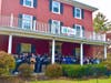 The entire community choir on the front porch of Oscar Hammerstein's former residence.
