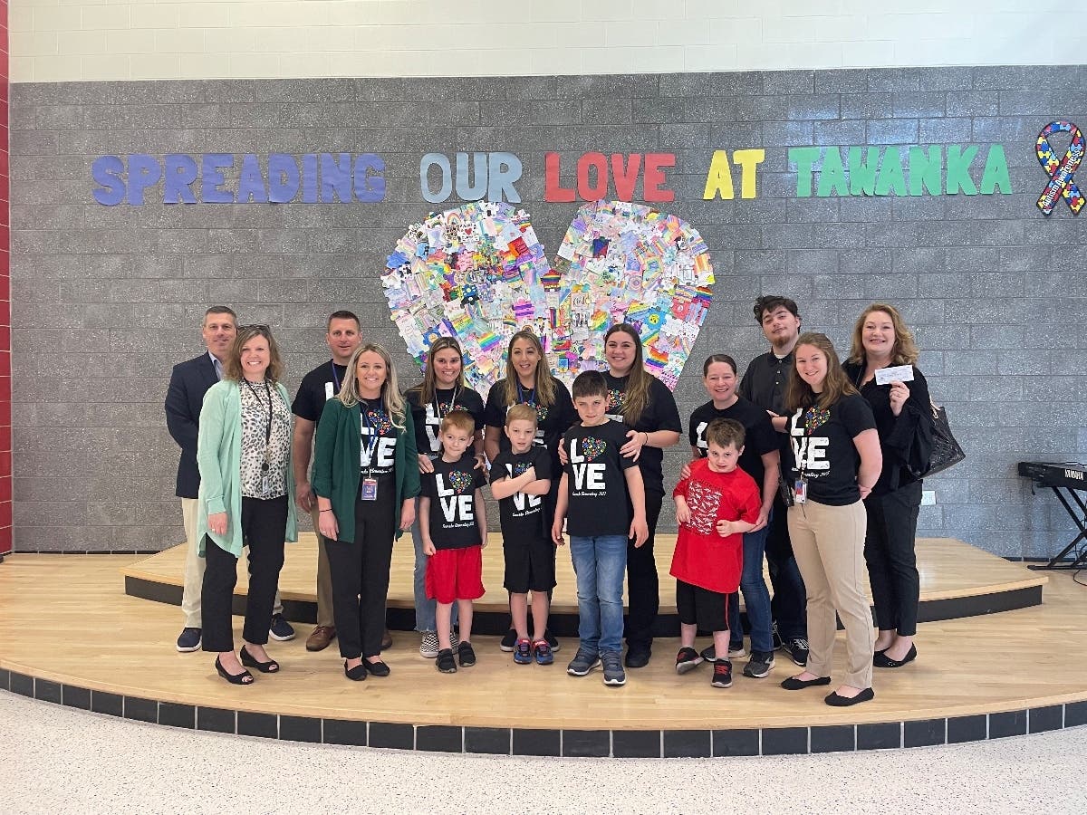 Tawanka Elementary School students and teachers raised money by designing and selling t-shirts for a local organization serving students with autism.