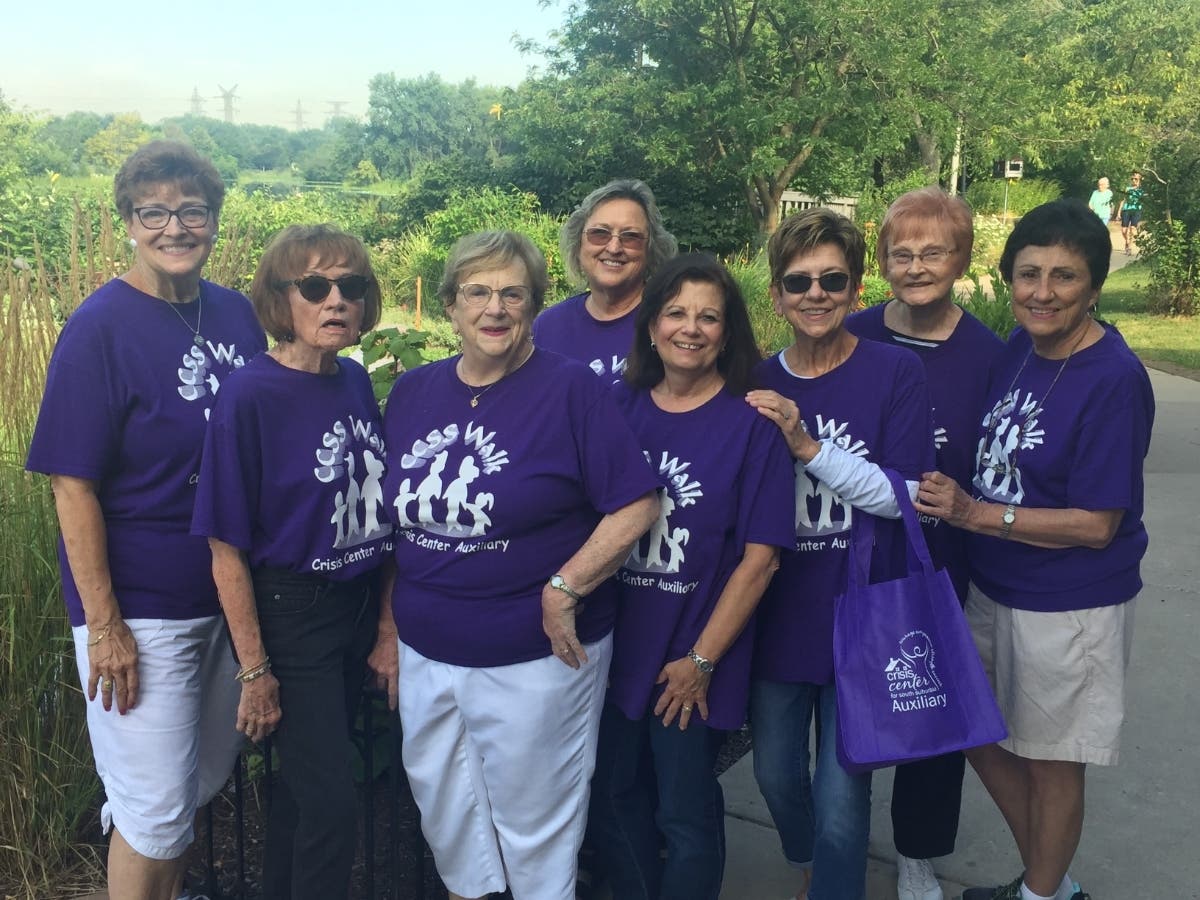 Members of the Crisis Center Auxiliary pause for a photo at a recent Walk Against Domestic Violence.