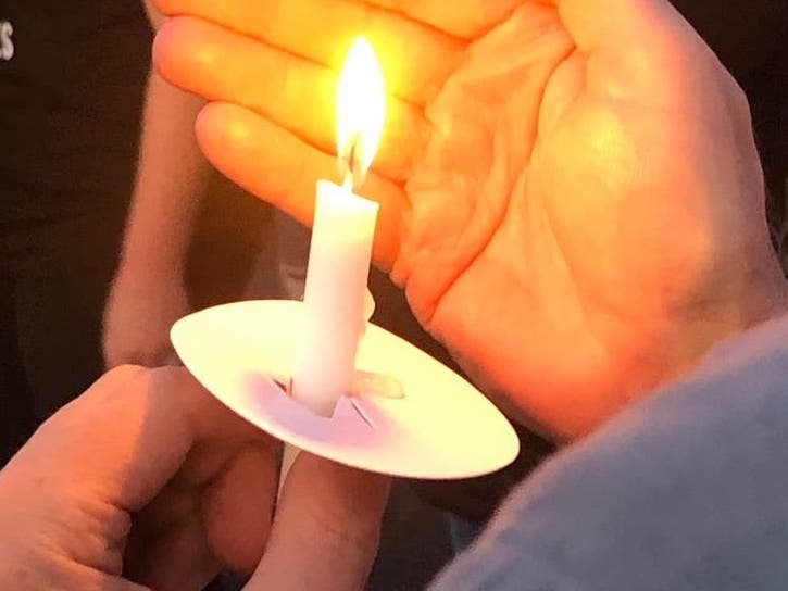 A person holds a candle at the vigil for the missing Hoggle siblings in 2019, on the fifth anniversary of Sarah and Jacob's disappearance. A Maryland court on Wednesday denied their mother's appeal to have murder charges against her dismissed.