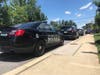 About 15 police cars blocked the complex's two entrances.