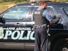 The Anne Arundel County Police Department said an Odenton woman was hospitalized Friday after a stray bullet hit her while she was sitting in her apartment.