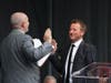 Anne Arundel County Court Clerk Scott A. Poyer (left) swears in Annapolis Mayor Gavin Buckley (right) at a Monday ceremony on West Street. This will be the Democrat's second term.