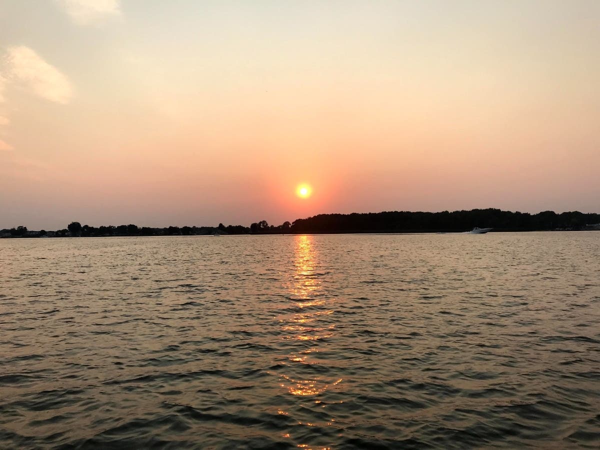 WTOP News Journalist Veronica Canales reported that a Saturday boat crash in the West River near Shady Side left one person dead and another hospitalized. The stock photo above shows a different waterway in Baltimore County.