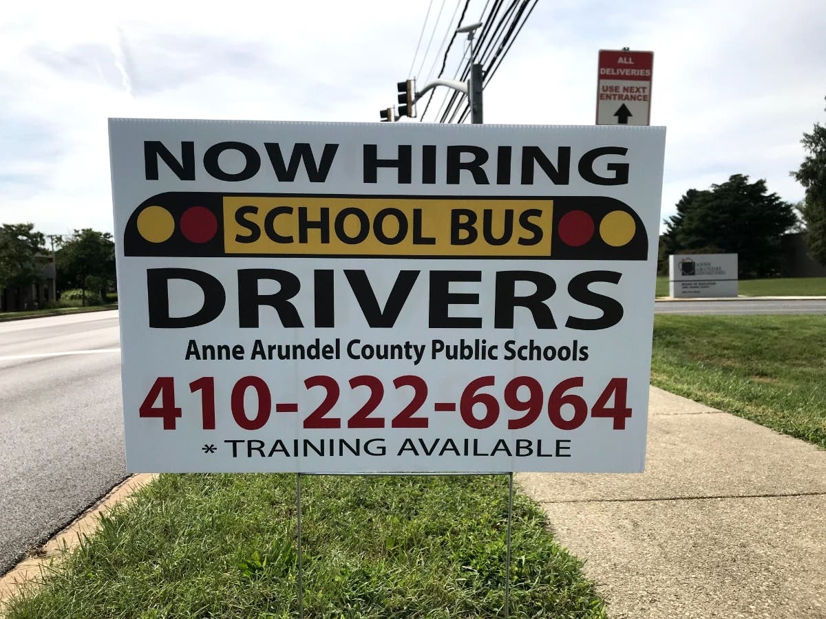 Anne Arundel County Public Schools is still battling a nationwide bus driver shortage. A sign recruiting drivers is pictured above last September outside the school system's Annapolis headquarters.
