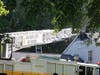 This ladder truck reached toward the home's roof.