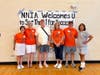 Members of the planning committee for the 2025 volleyball tournament pose at the close of last year's tournament.  