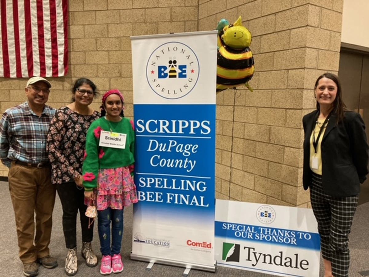 Srinidhi Rao and her parents (left), along with Assistant Regional Superintendent Amber Quirk (right), celebrate Rao's win at the 2023 DuPage County Spelling Bee.
