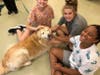 Three Girls Inc. Young Women Leadership campers meeting Karen Borgstrom’s therapy dog Kooper.
