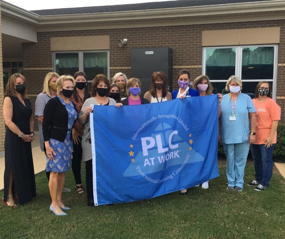 The elementary school was presented with a flag to commemorate the occasion.