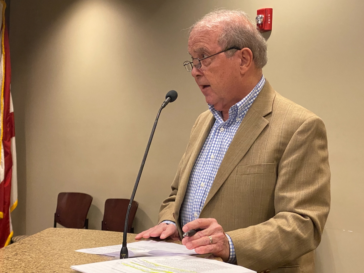 Northport City Attorney Ron Davis reads the resolution for the pay increases during Monday night's City Council meeting.