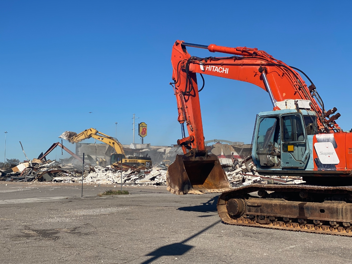 Heavy machinery tore down the structure to the west of Dollar General as Tuesday's phase of the demolition. 