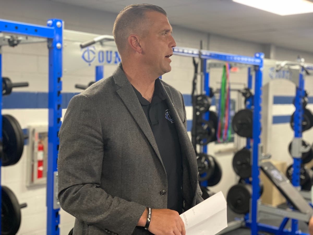 County High football coach Adam Winegarden speaks during an open house at the W.G. Sullivan Field House Sunday. 