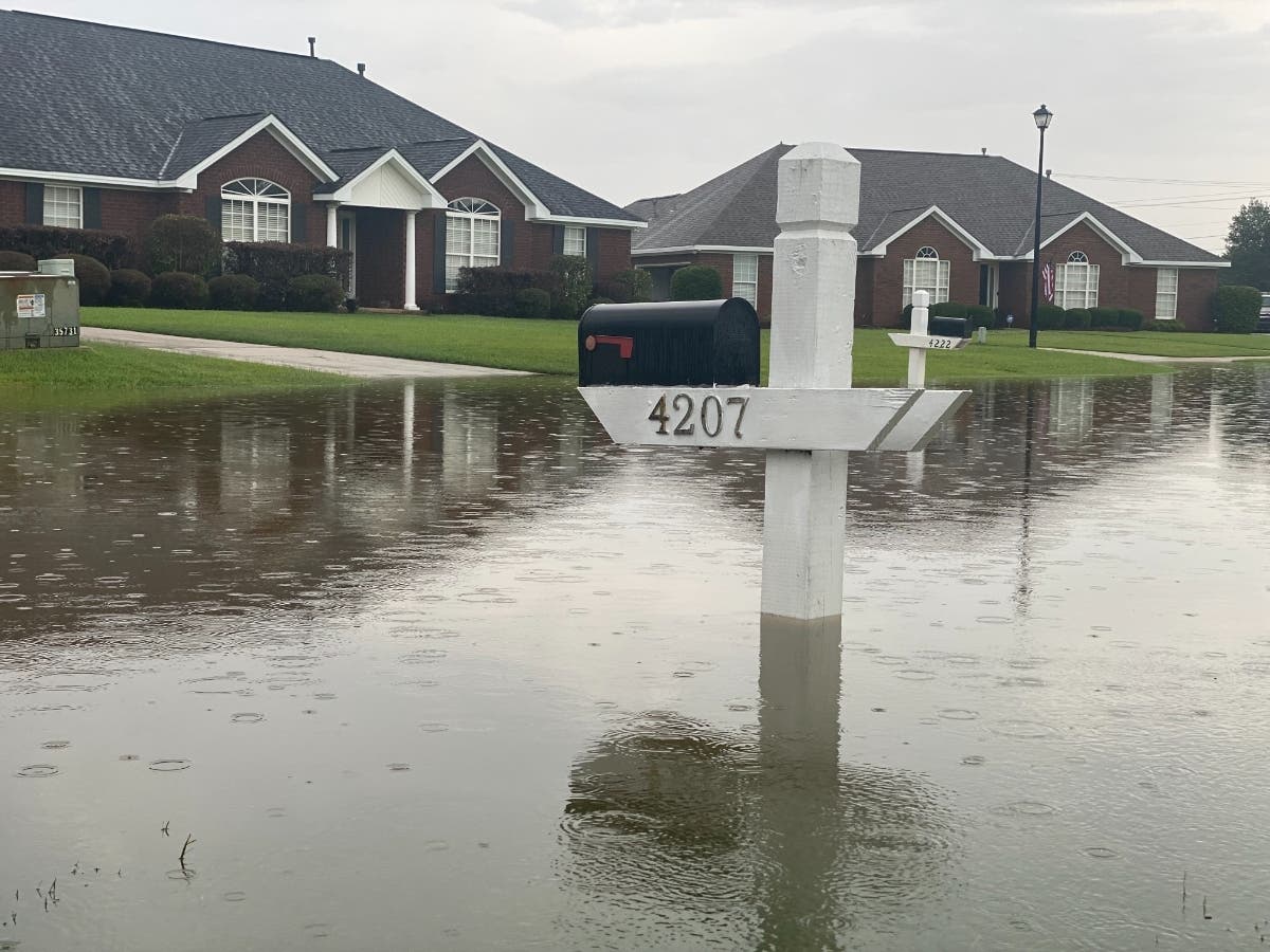 Carroll Street in Northport saw heavy flooding Friday evening as rain continued to drench the area. 