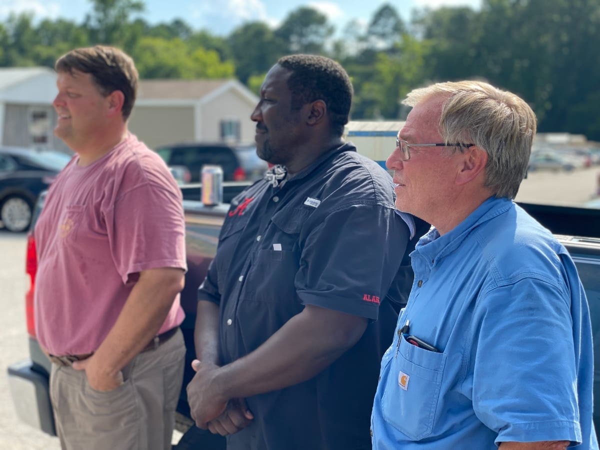 Willowbrook Trailer Park owner Todd Hamner, District 2 Councilman Woodrow Washington III and Mayor Bobby Herndon listen to a resident voice concerns on Thursday. 