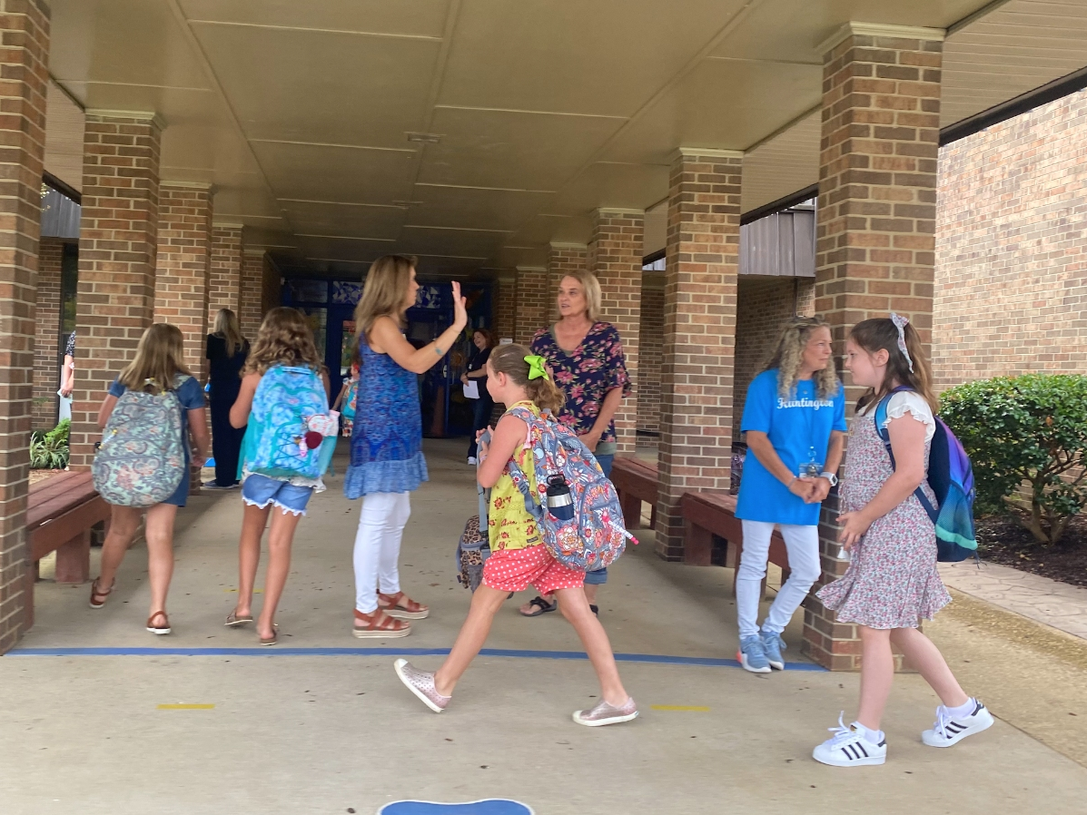Students filed in for their first day of the new school year at Huntington Place Elementary on Thursday