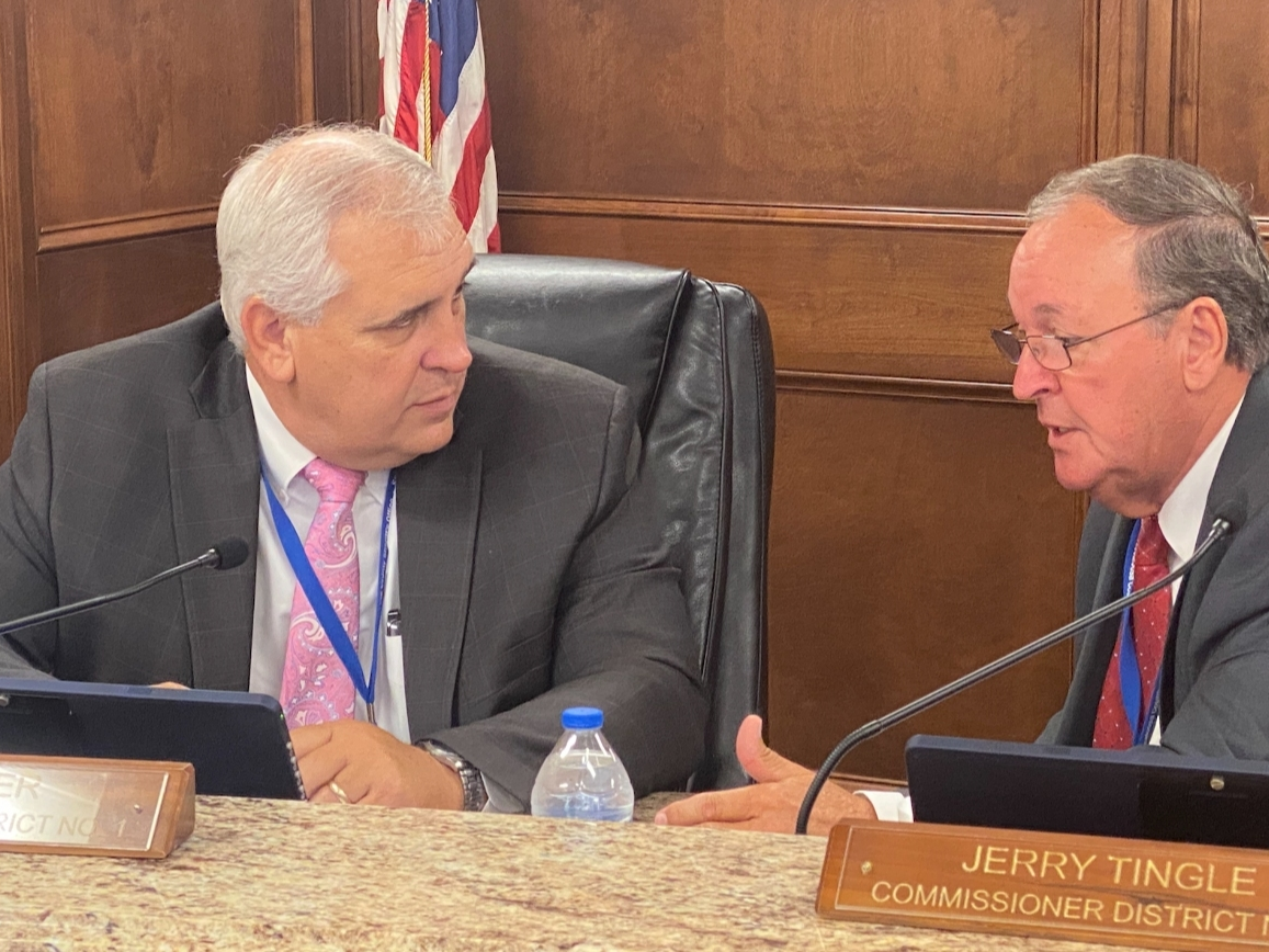 District 1 Commissioner Stan Acker, left, speaks with District 2 Commissioner Jerry Tingle following Wednesday's meeting. 