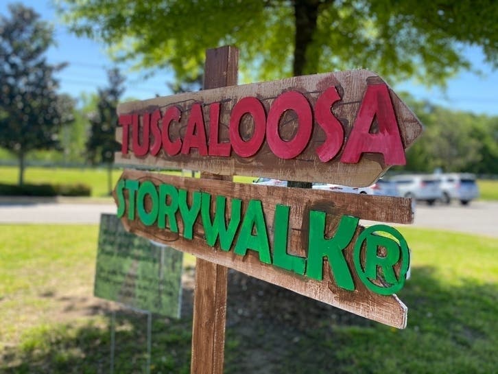 A sign marked the first Tuscaloosa StoryWalk in April at the Tuscaloosa River Walk. 